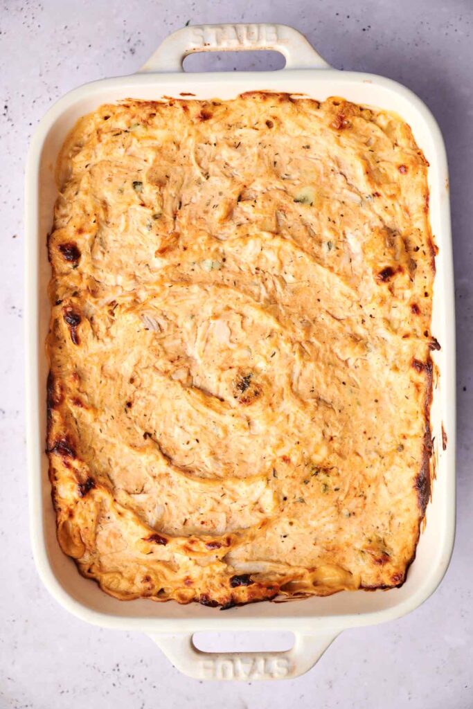 A baked casserole dish filled with a creamy, golden-brown potato or pasta mixture.