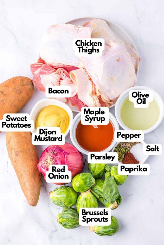 A delightful Maple Dijon Chicken Sheet Pan dinner awaits, with ingredients perfectly laid out: chicken thighs, crispy bacon, sweet potatoes, Brussels sprouts, tangy red onion, olive oil, creamy mustard, rich maple syrup, fresh parsley, smoky paprika, salt and pepper.