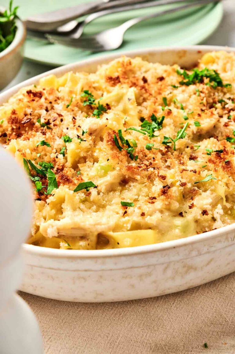 An Air Fryer Chicken Noodle Casserole dish brimming with creamy baked pasta, crowned with golden breadcrumbs and fresh parsley.