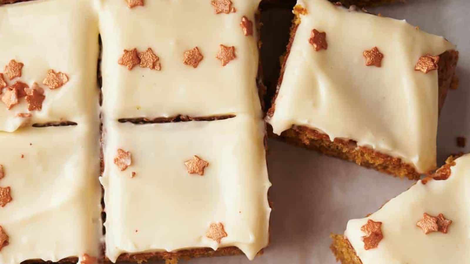 Close-up of cake slices topped with white frosting and decorated with small, star-shaped sprinkles.