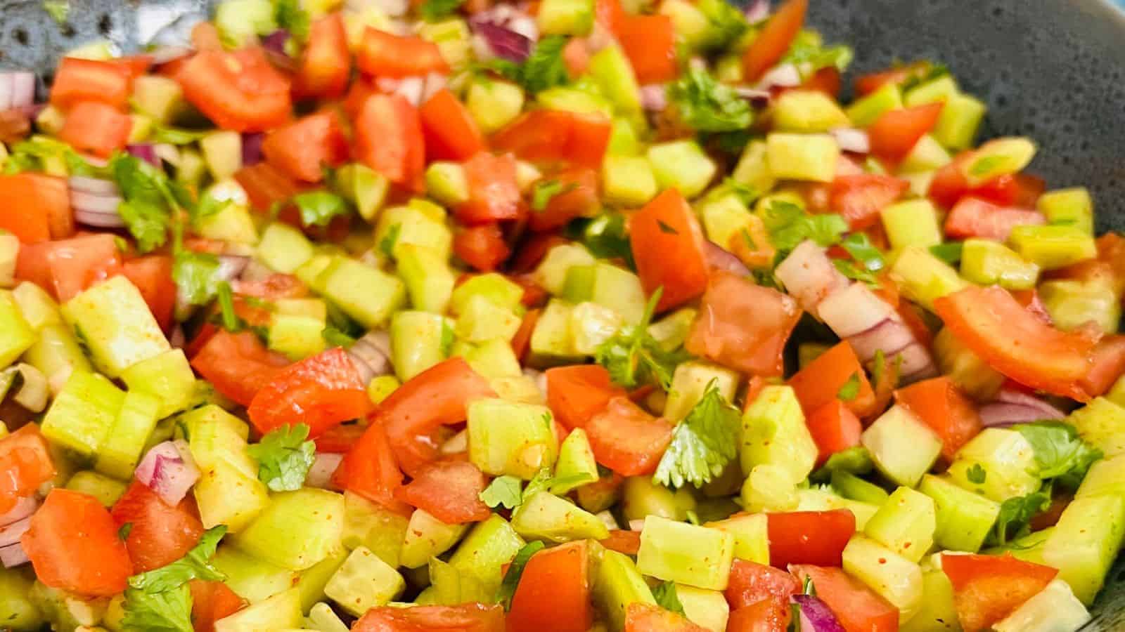 Kachumber salad in a grey bowl.