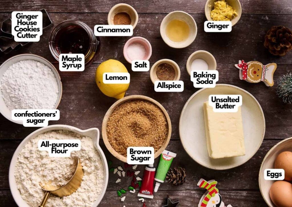 Baking ingredients laid out on a table include flour, sugars, butter, eggs, lemon, ginger, allspice, cinnamon, salt, baking soda, maple syrup, and a gingerbread cookie cutter—everything you need to create the perfect Gingerbread House from scratch.