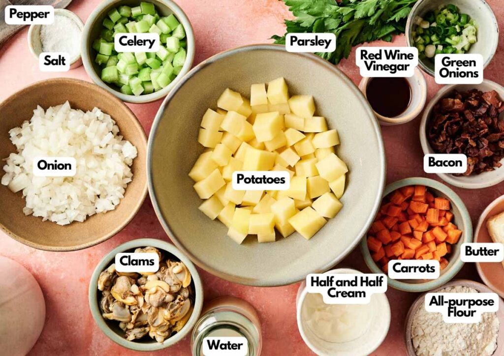 Ingredients for Clam Chowder are arranged in bowls and labeled, including potatoes, carrots, celery, onion, bacon, clams, cream, butter, flour, parsley, green onions, and seasonings. Perfect for homemade Clam Chowder recipes.